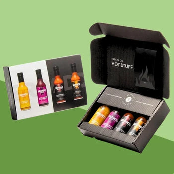 A Bravado Spice gift box containing four hot sauce bottles with distinct heat profiles.